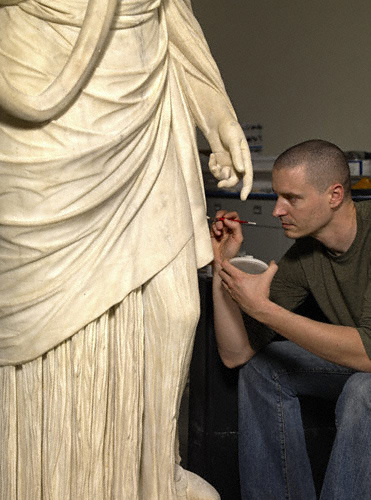 Getty conservator Erik Risser finishing in-painting of the Hope Hygieia