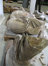 Large parts of the base and torso of the statue of a god in the Antiquities Conservation studio at the Getty Villa