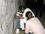 conservators working with grouts