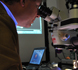 examining lacquer samples in lab