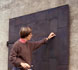 conservator working on stabilization of shutters