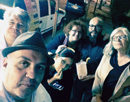 Luis Alfaro (lower left) and company on a trip to East L.A. eating churros from a cart on Whittier Blvd. 