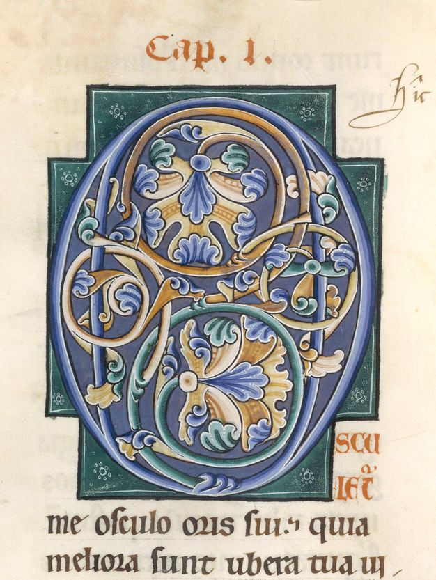A blue initial filled with yellow, blue, and green foliate ornament, within a cruciform green background.