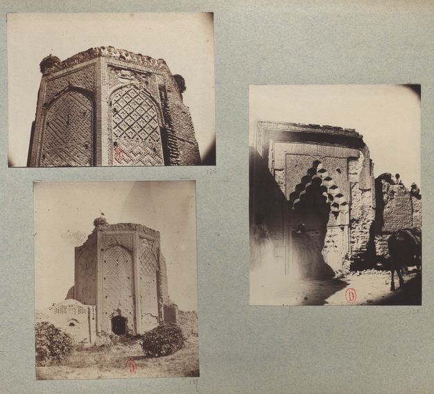A blue-gray album page with two stacked views of a tall brick tower (left) and one of a tiled niche (right).