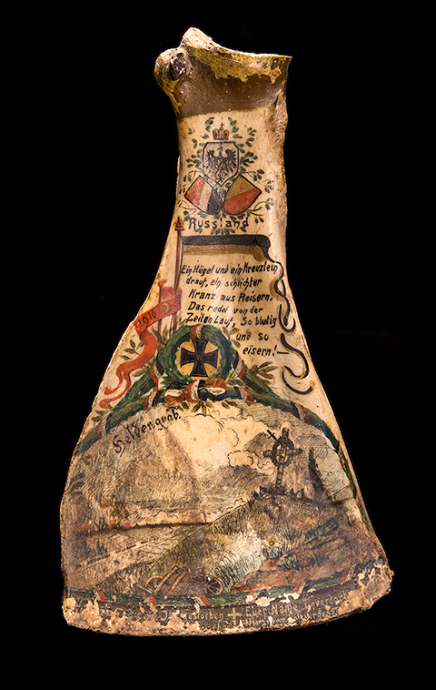 Cow shoulder bone with paint and illustrations