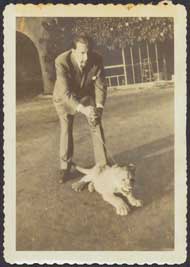 J. Paul Getty with lioness cub Teresa at his Malibu Ranch House.  