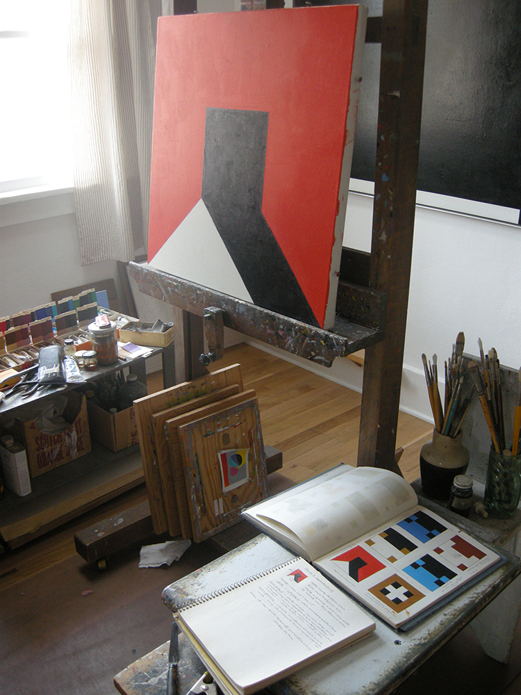 Notebooks and unfinished painting set up in Frederick Hammersley's studio in March 2012