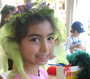 Girl wearing wreath at an art-making workshop