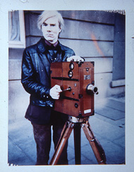 Andy Warhol with camera