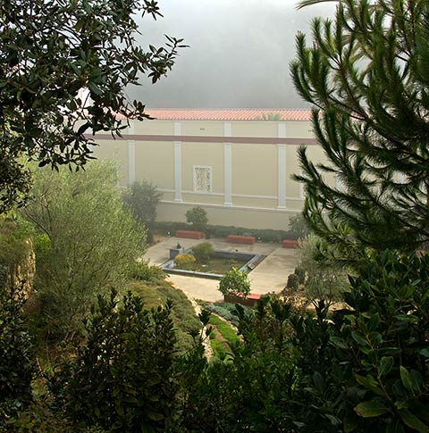 Visitors to the Villa walk along a scenic pathway to the heart of the site, and see the Villa from above, peeking through the trees.