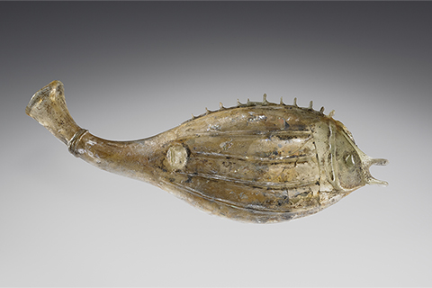 <a href='/art/collection/objects/221828/unknown-maker-fish-flask-roman-3rd-century-ad/'>Fish Flask</a>, Roman, 3rd century A.D. Shown is a free-blown flask of pale green glass in the shape of a fish that was made in the Roman Empire in the 3rd century A.D.