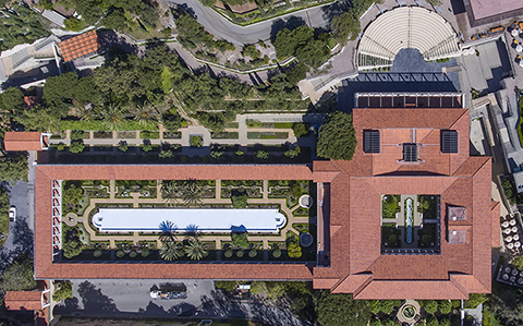 A bird's-eye view of the Getty Villa, showing the Outer Peristyle Garden at left extending from the museum. An aerial view of the Getty Villa that shows the overall architecture of the museum and gardens.
