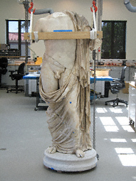 Statue of a God during conservation at the Getty Villa