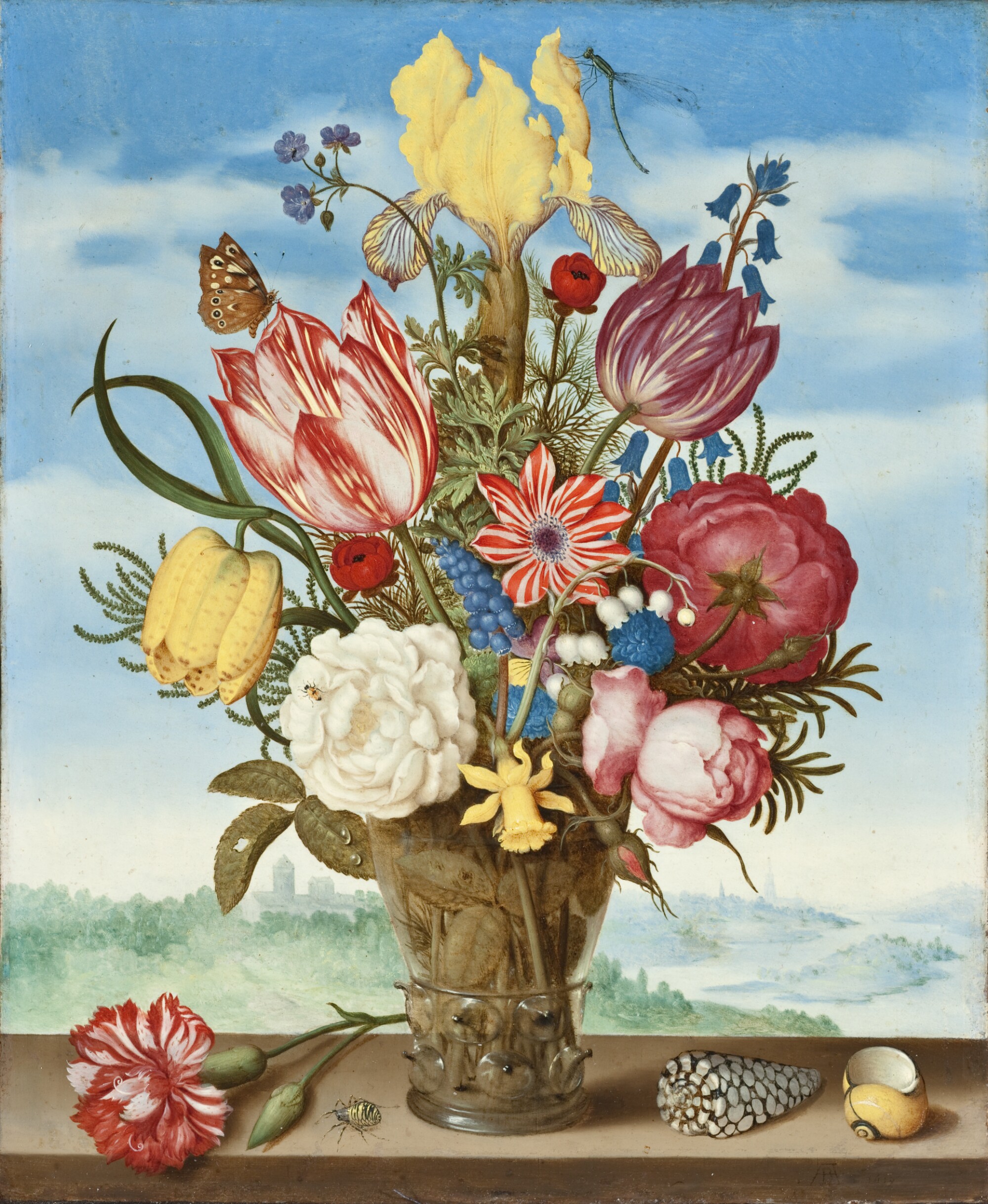A large colorful bouquet of flowers flows from a vase