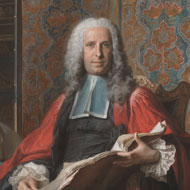  Portrait of white male in 1700s dress wearing a white, curled wig and red robes while he holds and open book