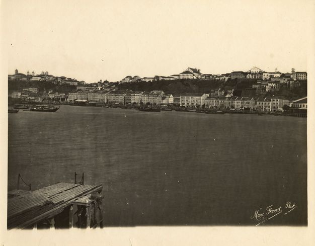 Sepia-toned coastal panorama, with a portion of the pier at lower left, taken and shown in two parts.