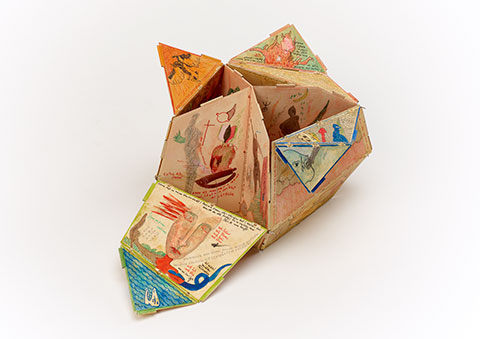 Watch the curator open The Philosopher's Stone, a small and colorful cardboard structure held together by steel pins depicts a series of narrative illustrations and accompanying texts rendered in colored ink, pencil, and watercolor.