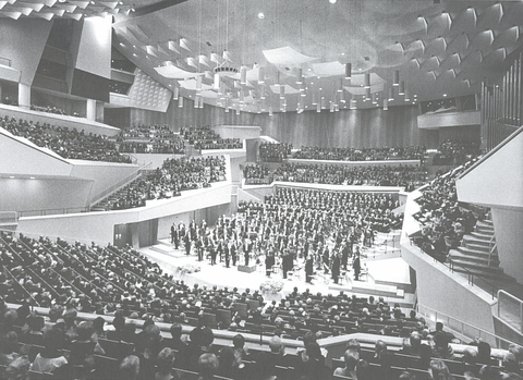 Black and white photo of the interior of the Berlin Philharmonic at the opening night performance in 1963. 