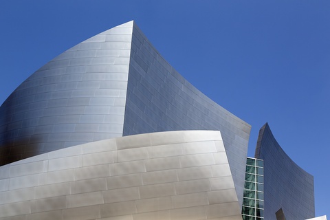 Color photo of the stainless steel, curvilinear exterior walls at the apex of Walt Disney Concert Hall.